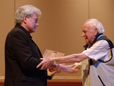 Bill Adam is presented with the ITG Award of Merit by Stephen Chenette, ITG President. Bill Adam is presented with the ITG Award of Merit by Stephen Chenette, ITG President.
